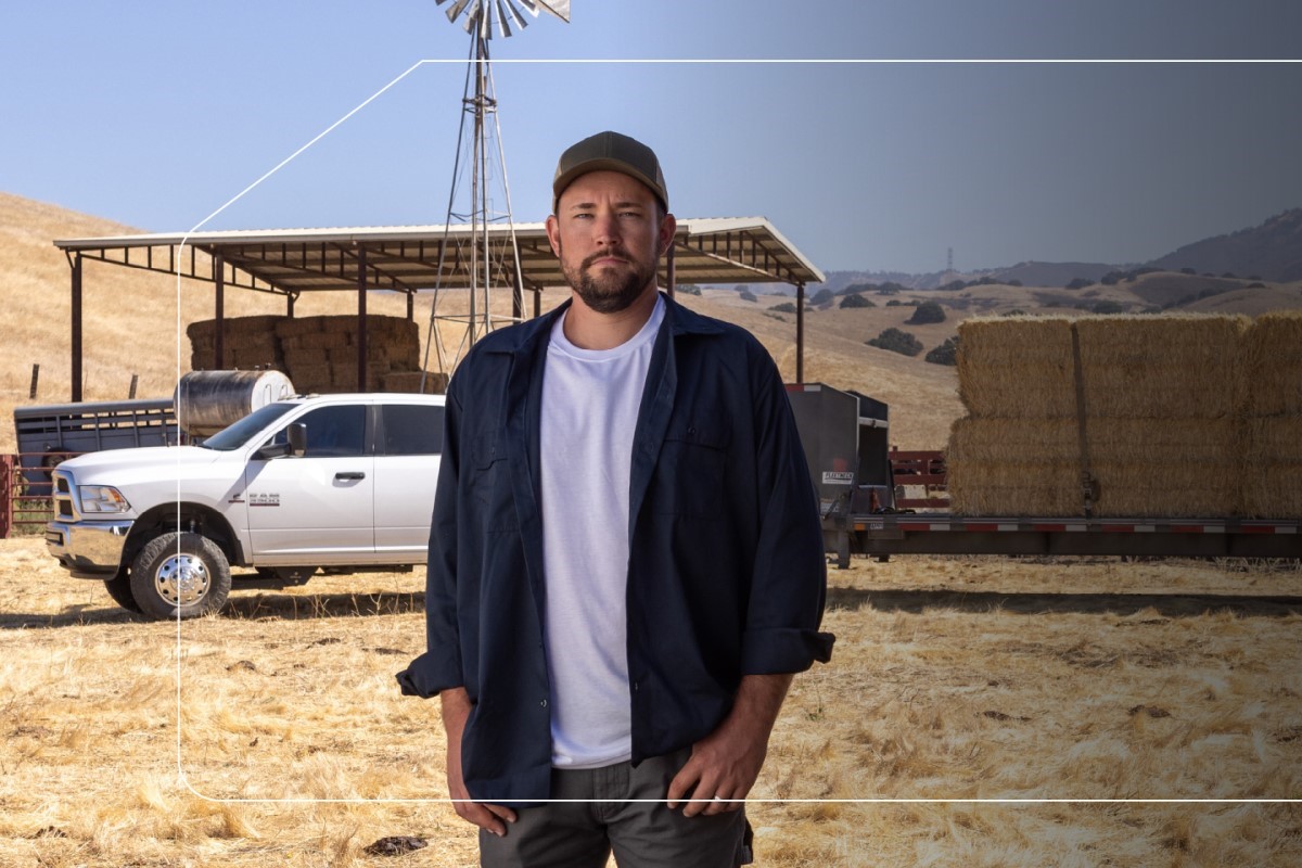 man posing with ram truck