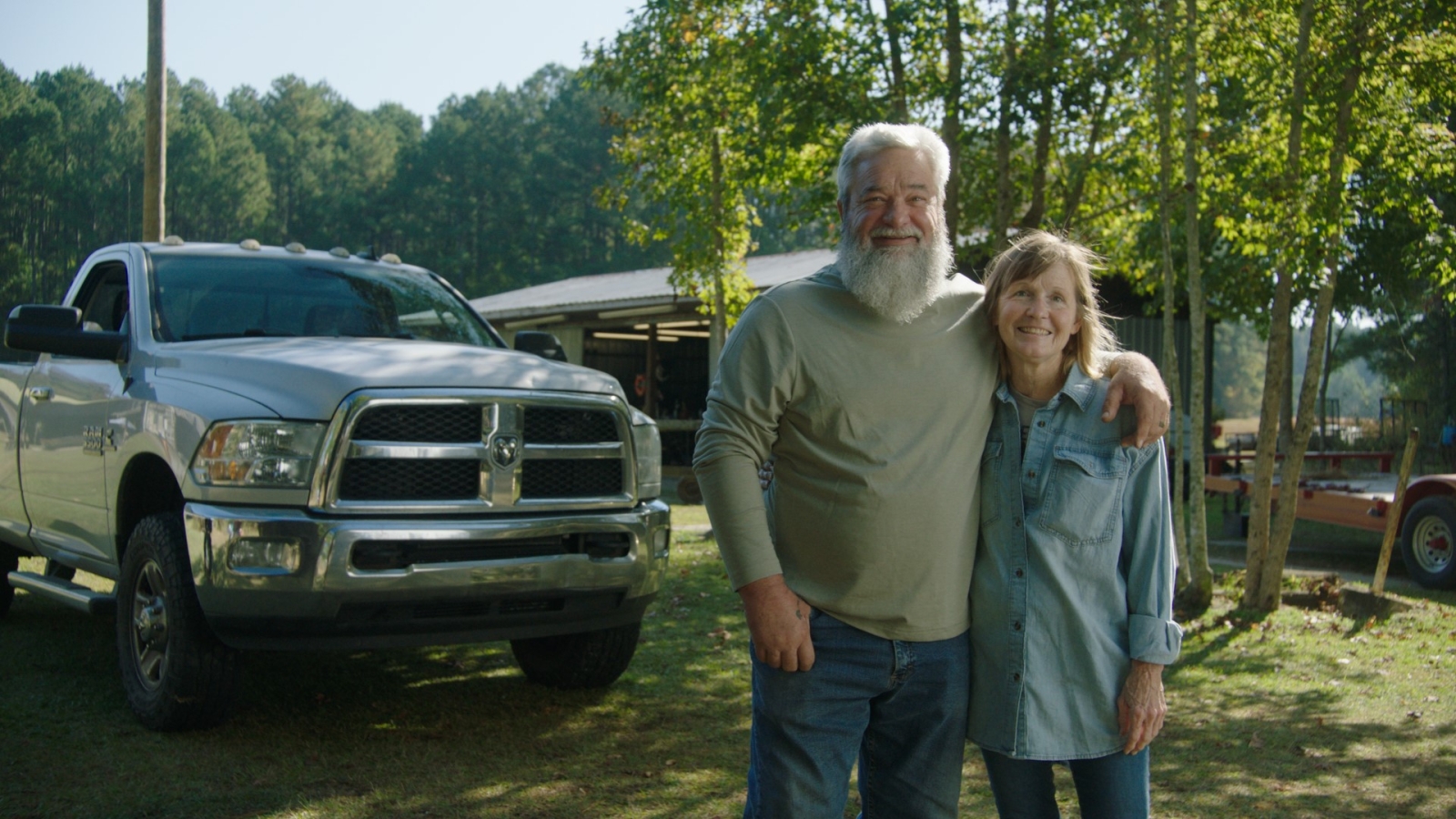 Couple in front of their truck