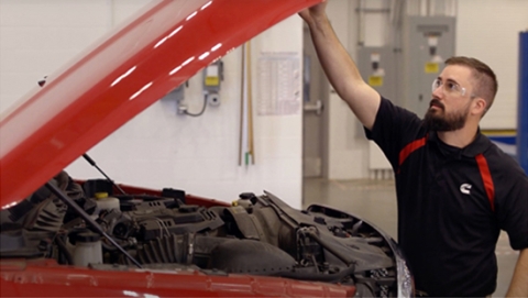 Cummins Mechanic looking at Ram truck