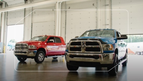 Two Ram trucks parked next to each other 